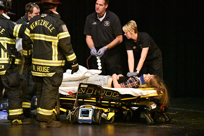 EMT tries to resuscitate Lydia Stewart (19) .