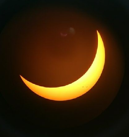 A sliver of the sun can still be seen with the solar lenses.