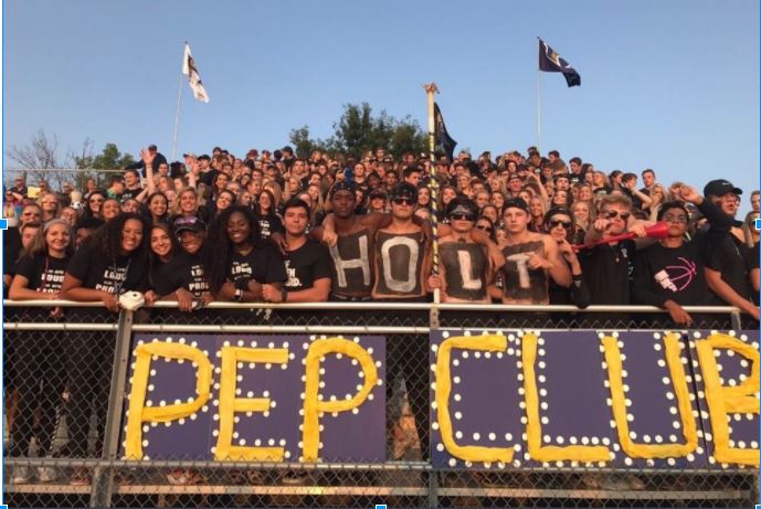 Holt students show off their school spirit by participating in the black out theme against their rival school, Timberland High School.
