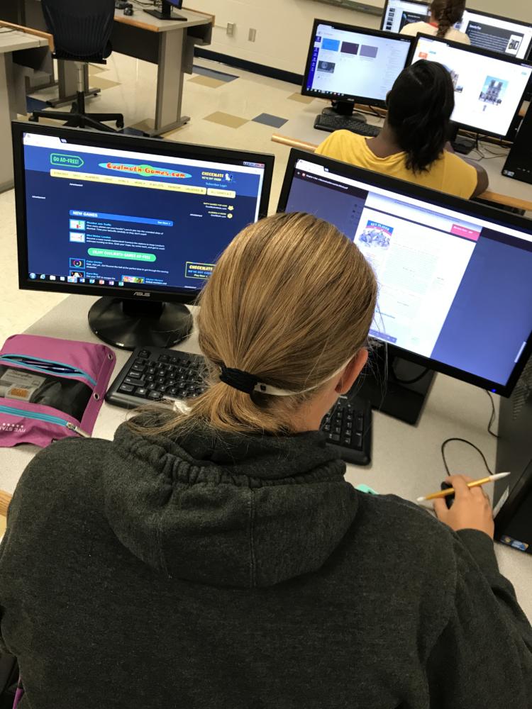 Studying hard while also being distracted, Kiersten Dooley (‘20) tries to get her work done. 
