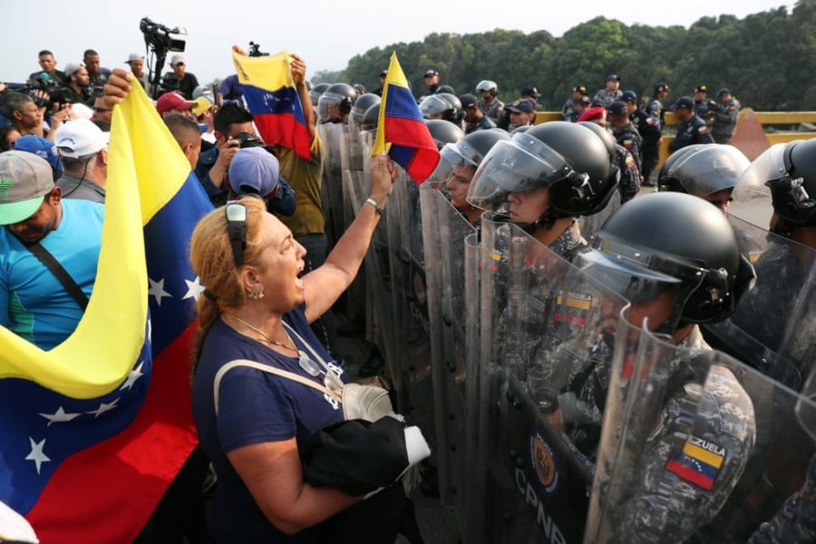 Columbian civilians stand off with Venezuelan forces at the border.