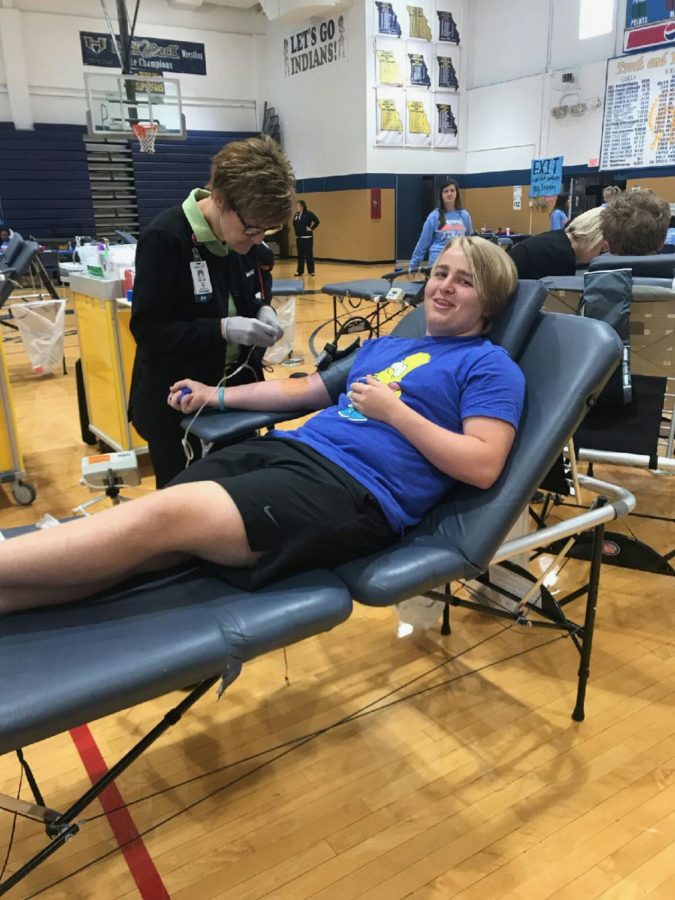 Sophomore Nick Hayes gets prepped by a Mercy nurse to give blood.