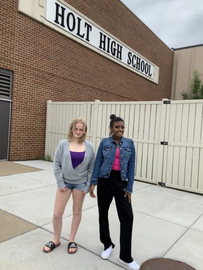 Students Tania Anderson(21) and Alysa Hand(21) stand in front of their new school