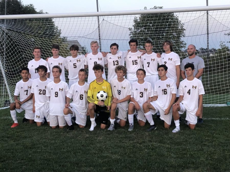 The JV boys soccer team  happy to take a photo on Timberlands home turf after the big win.