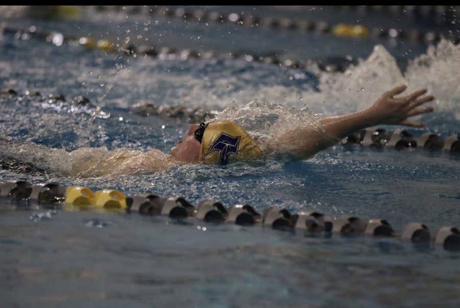 Talon Green swimming at GACs. Performing the Backstroke advancing to state. 