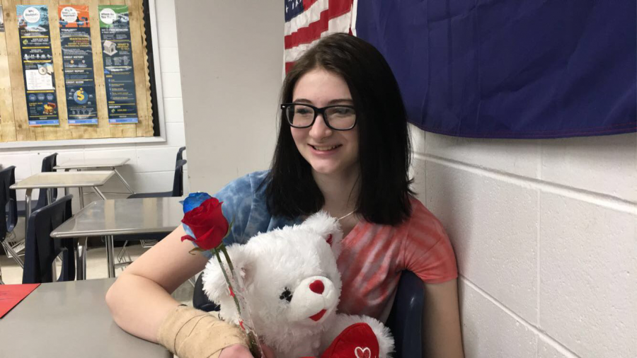 Alexis Stratman (22) holds all of the gifts she recieved for Valentines Day.