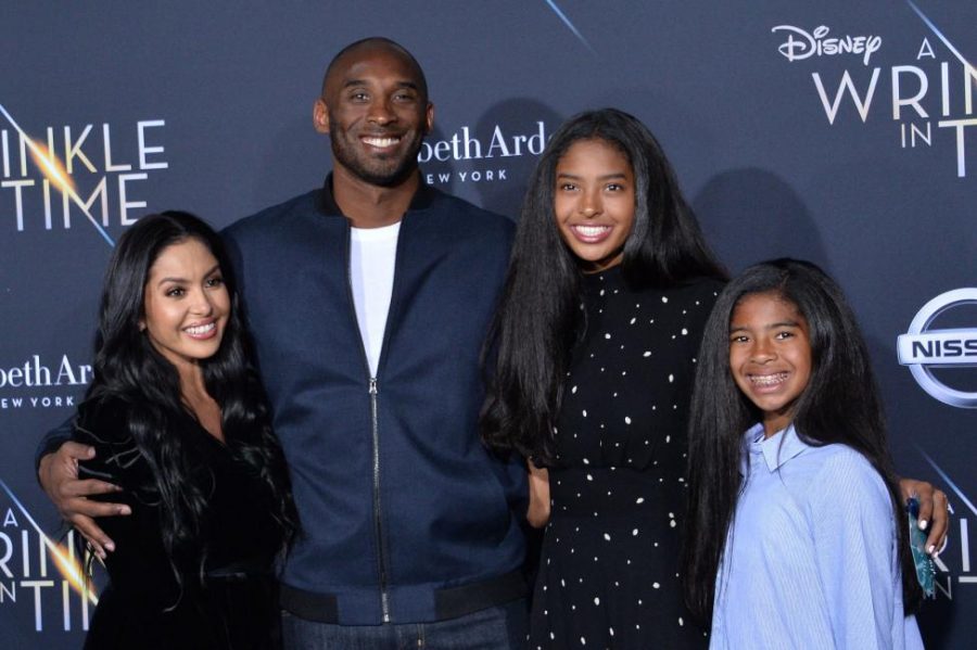 kobe poses for a picture with 3 of his daughters at The Wrinkle in Time world premiere.