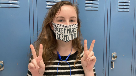 Kinslee Keatts (22) poses wearing a respectful message on her mask. Make sure what you decide to wear is also repectful!