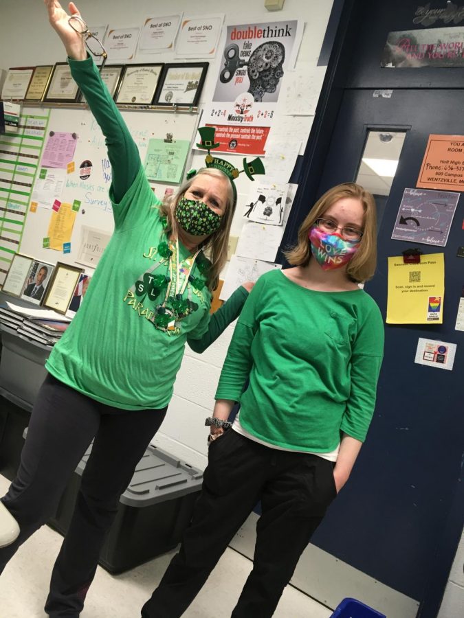 Sydney Swanson and Emily Teismann (21) show spirit in wearing green on St Patrick's Day.