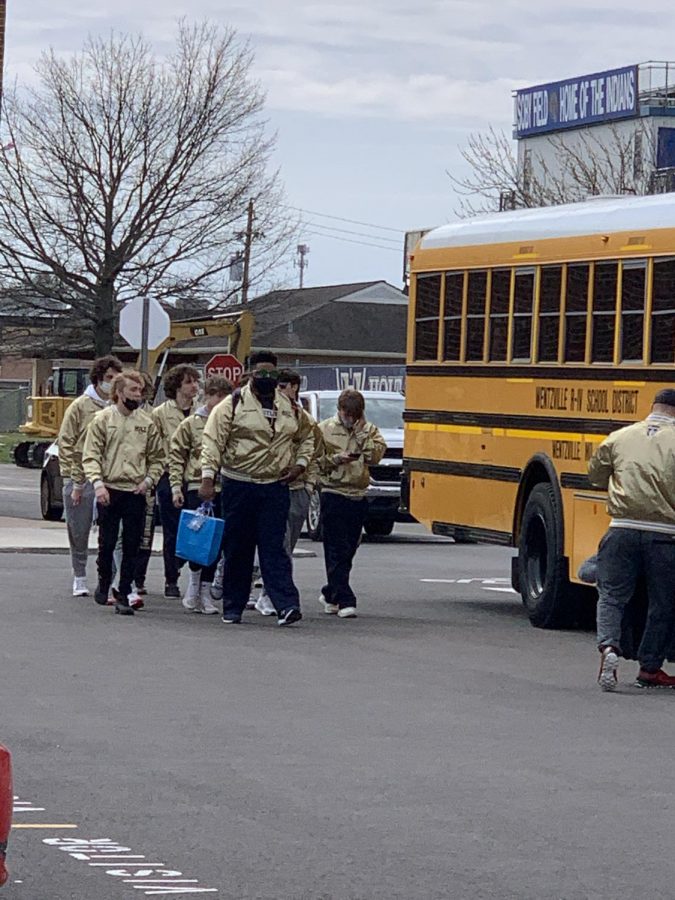 The boys wrestling teams state qualifiers get ready to head on the bus.