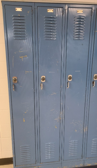 Lockers at Holt, bruised and with peeling paint.