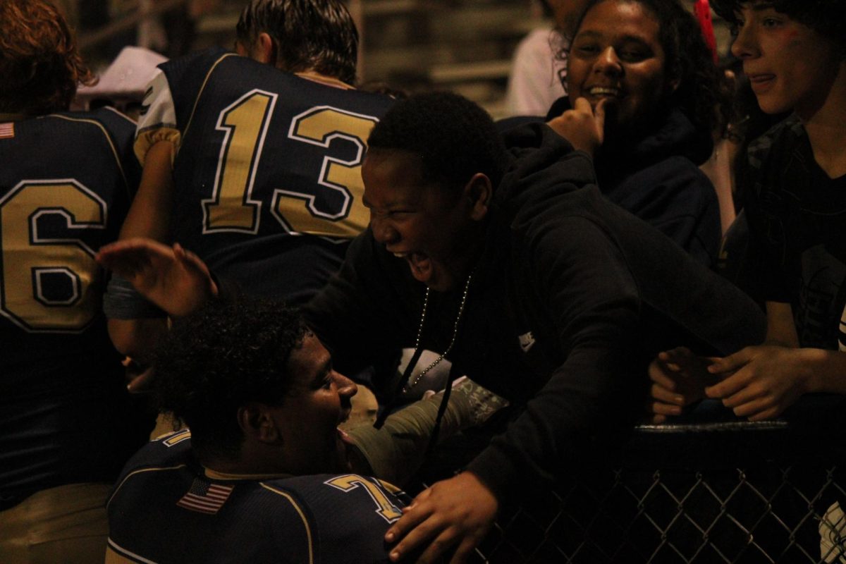 Jeffery Thomas (25) shares his excitement with Kamdon Lopez (25) after their victory against Timberland.