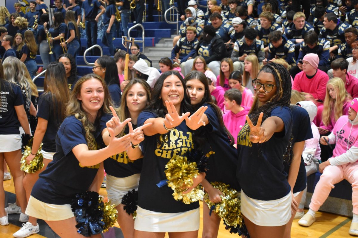 Seniors Madelyn Cristel and Erris McLain show their school spirit with Juniors Lanie Steinbruegge and NyIma Burchfield and Sophomore Alissa Griffin A at the schools homecoming pep assembly