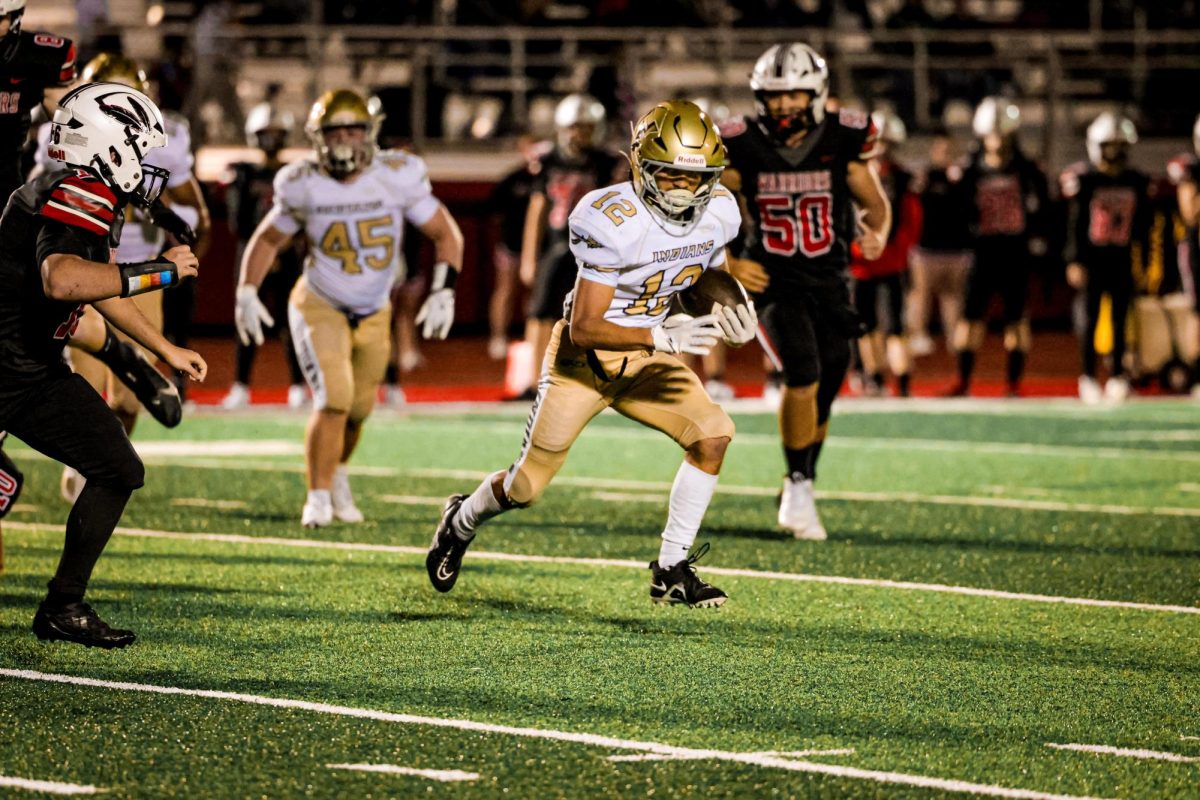 Xavier Adams ('25) shows his determination on field as he hustles to get to the endzone.